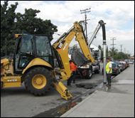 yellow bulldozer on sidewalk