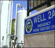 Well 2A sign with detailed phone number